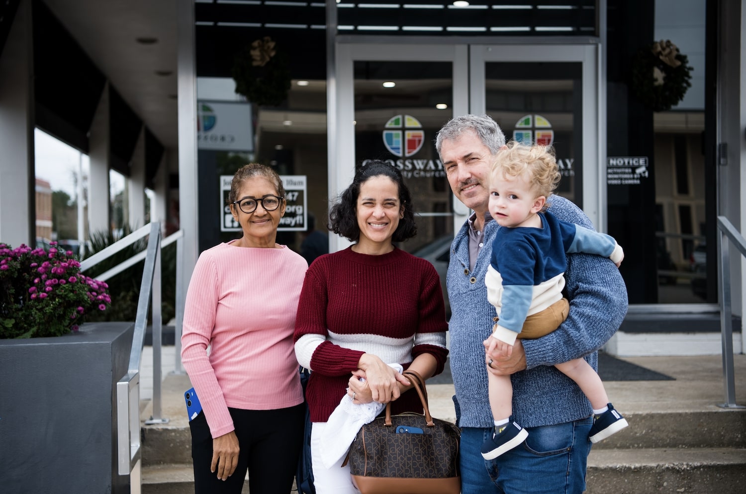 People pose smiling in front of CrossWay Community Church in Crestview, FL